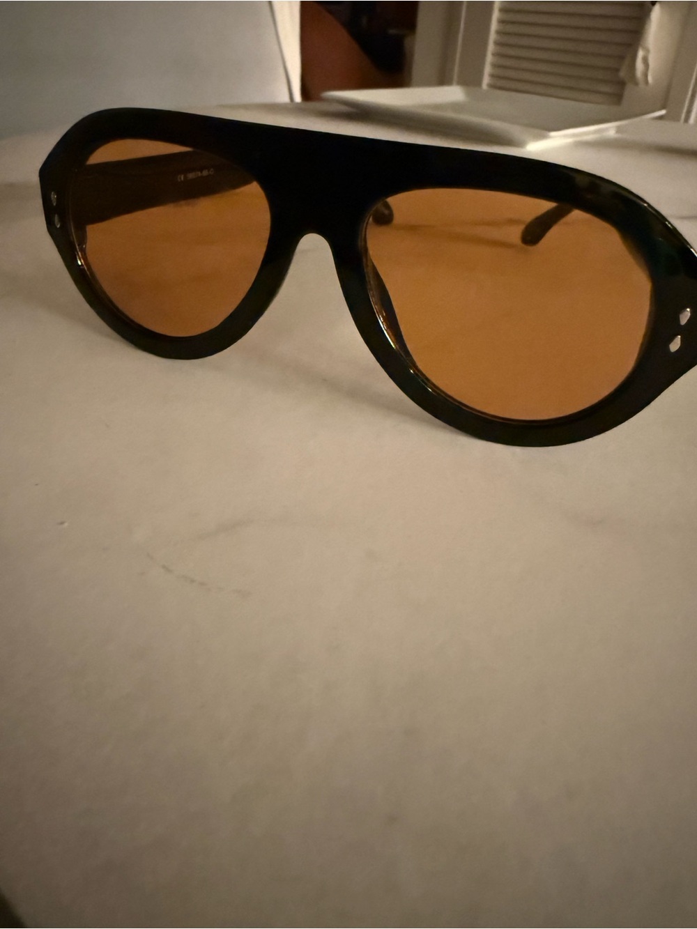 Women’s Black Frame Aviator Sunglasses with Amber Lenses from Free People